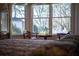 Chairs and views through a bright bay window in main bedroom at 520 Camp Perrin Rd, Lawrenceville, GA 30043