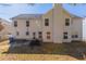 Exterior backyard featuring a lawn, trees, and rear exterior at 7635 Jumpers Trl, Fairburn, GA 30213