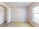 Bedroom with closet, natural light, and neutral walls at 7635 Jumpers Trl, Fairburn, GA 30213