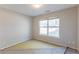 Bedroom featuring a bright window, with the opportunity to install new flooring at 7635 Jumpers Trl, Fairburn, GA 30213