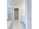 Modern bathroom features tile floors, a glass shower, double vanity, and a walk-in closet at 249 Chiswick Loop, Stockbridge, GA 30281