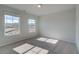 Bedroom has carpeting, two windows and natural light at 249 Chiswick Loop, Stockbridge, GA 30281