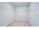 Walk-in closet with carpet flooring and white wire shelving for ample storage at 249 Chiswick Loop, Stockbridge, GA 30281