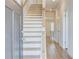 Inviting entryway with hardwood floors and staircase leading to the upper level at 249 Chiswick Loop, Stockbridge, GA 30281