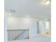 Hallway with neutral tones and a view of the upstairs layout at 249 Chiswick Loop, Stockbridge, GA 30281