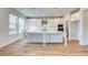 Contemporary kitchen featuring stainless steel appliances, a large island, and ample counter space at 249 Chiswick Loop, Stockbridge, GA 30281