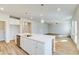 Modern kitchen with a large island, stainless steel appliances, and an open floor plan at 249 Chiswick Loop, Stockbridge, GA 30281