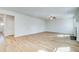 Spacious living room with hardwood floors, a ceiling fan, and a cozy fireplace at 249 Chiswick Loop, Stockbridge, GA 30281