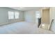 Upstairs loft area featuring carpeted floors and plenty of natural light at 249 Chiswick Loop, Stockbridge, GA 30281