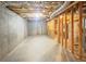 Unfinished basement features a concrete floor, exposed ceiling, and wood frame for future customization at 3348 Terrace Hedge Pl, Dacula, GA 30019