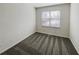 This bedroom features neutral paint, modern carpet, and a large window for ample natural lighting at 3348 Terrace Hedge Pl, Dacula, GA 30019