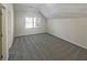 Bright bedroom featuring neutral walls, neutral carpeting, and a view to the outside at 3348 Terrace Hedge Pl, Dacula, GA 30019