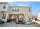 A backyard view from the patio, showing siding, windows, and a patio set at 5751 Evadale Trce # 4, Mableton, GA 30126