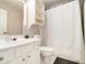 Clean bathroom featuring a shower/tub combo and convenient storage at 5751 Evadale Trace, Mableton, GA 30126