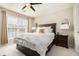 Bright bedroom featuring a ceiling fan, large window, and stylish furnishings at 5751 Evadale Trce # 4, Mableton, GA 30126