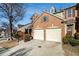 Charming brick townhome featuring a two-car garage and a well-manicured lawn at 5751 Evadale Trce # 4, Mableton, GA 30126