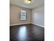 Bedroom with beautiful hardwood floors and natural light at 7603 Autumn Breeze, Douglasville, GA 30134