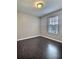 Bedroom features hardwood floors and natural light from a window at 7603 Autumn Breeze, Douglasville, GA 30134