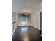 Dining area showcasing hardwood floors and a modern light fixture at 7603 Autumn Breeze, Douglasville, GA 30134