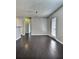 Bright living room with dark wood floors and a minimalist design at 7603 Autumn Breeze, Douglasville, GA 30134