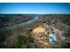 Aerial view showcasing a riverside park with a pool, playground, and recreational area at 9625 River Lake Dr, Roswell, GA 30075