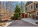 Exterior view of the backyard with patio, outdoor grill, and small shed at 9625 River Lake Dr, Roswell, GA 30075