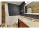 This bathroom features a granite-top vanity and a shower-tub combo with neutral tile at 9625 River Lake Dr, Roswell, GA 30075