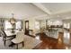 Open-concept dining area featuring a wooden table, decorative lighting, and a seamless transition to the kitchen at 9625 River Lake Dr, Roswell, GA 30075