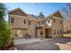 Back exterior of home with a deck, patio, and grill at 9625 River Lake Dr, Roswell, GA 30075