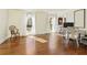 Bright living room with hardwood floors, large windows, and desk area at 9625 River Lake Dr, Roswell, GA 30075