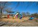 Playground area featuring colorful slides, swings, and play structures for outdoor fun at 9625 River Lake Dr, Roswell, GA 30075