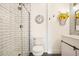 Bright bathroom with a glass-enclosed shower and floral decor at 1251 Oakdale Rd, Canton, GA 30114