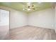 Spacious bedroom with sleek ceiling fan, luxury vinyl plank flooring, and fresh, light grey paint at 1251 Oakdale Rd, Canton, GA 30114