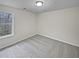 Comfortable bedroom with plush carpeting and ample natural light from a large window at 1835 Big Haynes Ct, Grayson, GA 30017