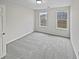 Spacious bedroom with dual windows allowing for lots of natural light and soft carpeting at 1835 Big Haynes Ct, Grayson, GA 30017