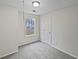Small bedroom featuring a large window, plush carpeting and interior door at 1835 Big Haynes Ct, Grayson, GA 30017