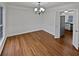 Bright dining room featuring hardwood floors and classic chandelier at 1835 Big Haynes Ct, Grayson, GA 30017