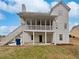 Exterior of house with screened deck, white stairs, and backyard at 1835 Big Haynes Ct, Grayson, GA 30017