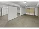 An unfinished garage with an industrial ceiling and a gray concrete floor at 1835 Big Haynes Ct, Grayson, GA 30017