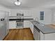 Modern kitchen with stainless steel appliances, granite countertops, and white cabinetry at 1835 Big Haynes Ct, Grayson, GA 30017