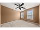 Bedroom featuring carpet floors, a ceiling fan and two windows at 692 Sedgwick Dr, Jonesboro, GA 30238