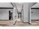 Hallway showcasing modern flooring and neutral paint, leading to other areas of the home at 692 Sedgwick Dr, Jonesboro, GA 30238