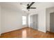 Bedroom features hardwood floors, two closets, a ceiling fan, and windows for natural light at 624 3Rd Ave, Decatur, GA 30030