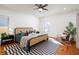 Stylish bedroom with hardwood floors, patterned rug, and bright natural light at 624 3Rd Ave, Decatur, GA 30030