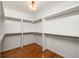 Large walk-in closet offers custom shelving and hardwood floors for organized storage at 624 3Rd Ave, Decatur, GA 30030