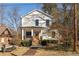 Two story home with a front porch and stairs, and a well-maintained yard at 624 3Rd Ave, Decatur, GA 30030