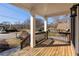 A covered front porch with a wood deck floor and railing at 624 3Rd Ave, Decatur, GA 30030