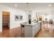 Well-designed kitchen island with a granite countertop, stainless steel sink, and hardwood floors at 624 3Rd Ave, Decatur, GA 30030