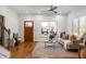 Cozy living room features hardwood floors, a neutral color scheme, and large windows at 624 3Rd Ave, Decatur, GA 30030