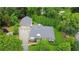 Aerial view of a stone house with lush landscaping and a long driveway at 716 Counsel Ne Dr, Marietta, GA 30068